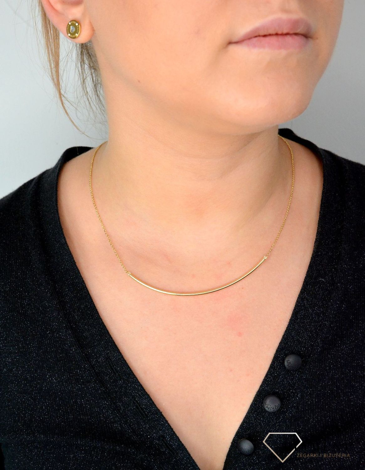 Złoty naszyjnik ze sztywną ozdobą zakończony cyrkonią NA 2971.jpg